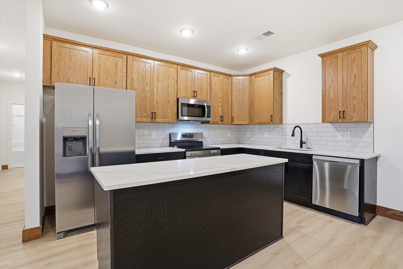 Kitchen with island and stainless appliances